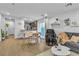 Dining area with white table, wood chairs and kitchen views at 4070 Emerald Wood St, Las Vegas, NV 89115