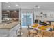 Open concept dining area with kitchen and living room views at 4070 Emerald Wood St, Las Vegas, NV 89115