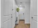 Bright entryway with wood floors, white doors, and a plant at 4070 Emerald Wood St, Las Vegas, NV 89115