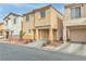 Two-story house with attached garage, and driveway, next to similar house at 4070 Emerald Wood St, Las Vegas, NV 89115