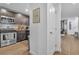 Modern kitchen with dark gray cabinets, stainless steel appliances, and granite counters at 4070 Emerald Wood St, Las Vegas, NV 89115