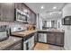 Updated kitchen featuring stainless steel appliances and dark cabinetry at 4070 Emerald Wood St, Las Vegas, NV 89115