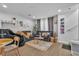 Relaxing living room featuring a gray sectional sofa and large windows at 4070 Emerald Wood St, Las Vegas, NV 89115