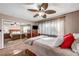 Bright bedroom with mirrored closet doors and ceiling fan at 4089 Patterson Ave, Las Vegas, NV 89104