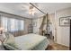 Bedroom with canopy bed, ceiling fan, and built-in shelving at 4089 Patterson Ave, Las Vegas, NV 89104