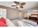 Spacious bedroom with mirrored closet doors and ceiling fan at 4089 Patterson Ave, Las Vegas, NV 89104