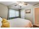 Cozy bedroom featuring a ceiling fan and large window at 4089 Patterson Ave, Las Vegas, NV 89104