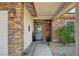 Inviting entryway with stone accents and a gray front door at 4089 Patterson Ave, Las Vegas, NV 89104