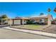 House exterior showcasing a carport, solar panels, and well-maintained landscaping at 4089 Patterson Ave, Las Vegas, NV 89104