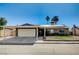 Single-story home with carport, solar panels, and landscaped front yard at 4089 Patterson Ave, Las Vegas, NV 89104