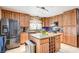 Spacious kitchen with stainless steel appliances and an island with wine rack at 4089 Patterson Ave, Las Vegas, NV 89104