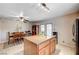 Bright kitchen with island, granite countertops, and breakfast area at 4089 Patterson Ave, Las Vegas, NV 89104