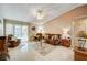 Spacious living room featuring a brown couch and tile flooring at 4089 Patterson Ave, Las Vegas, NV 89104