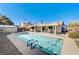 Relaxing pool area with patio furniture and solar panels at 4089 Patterson Ave, Las Vegas, NV 89104