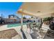 Inviting pool area with patio furniture and covered seating at 4089 Patterson Ave, Las Vegas, NV 89104