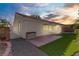 Landscaped backyard with patio and grassy area at 4176 Demoline Cir, Las Vegas, NV 89141