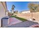 Landscaped backyard with patio and artificial turf at 4176 Demoline Cir, Las Vegas, NV 89141