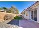 Brick patio and artificial turf in backyard at 4176 Demoline Cir, Las Vegas, NV 89141