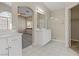 Bathroom with double vanity, shower, and linen closet at 4176 Demoline Cir, Las Vegas, NV 89141