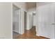 Clean hallway with wood flooring and access to other rooms at 4176 Demoline Cir, Las Vegas, NV 89141