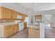 Kitchen features oak cabinets and tile backsplash at 4176 Demoline Cir, Las Vegas, NV 89141