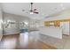 Bright kitchen with oak cabinets, tile flooring, and island at 4176 Demoline Cir, Las Vegas, NV 89141