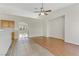 Bright living room with tile and wood flooring, high ceilings, and ceiling fan at 4176 Demoline Cir, Las Vegas, NV 89141