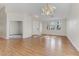 Spacious living room featuring hardwood floors, neutral walls, and large windows at 4176 Demoline Cir, Las Vegas, NV 89141