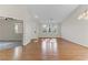 Living room with hardwood floors, neutral paint, and an open floor plan at 4176 Demoline Cir, Las Vegas, NV 89141