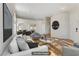 Virtually staged living room features hardwood floors, neutral walls, and ample natural light at 4176 Demoline Cir, Las Vegas, NV 89141