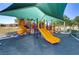 Modern playground equipment under a shaded area at 4176 Demoline Cir, Las Vegas, NV 89141