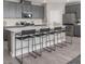 Modern kitchen with gray cabinetry, white countertops, and a large island at 4181 Nopal Serrano Ave, Las Vegas, NV 89141