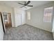 Spacious bedroom with carpet, ceiling fan and double closet at 4290 S Gressa St, Pahrump, NV 89061