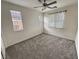 Well-lit bedroom with carpet and window coverings at 4290 S Gressa St, Pahrump, NV 89061