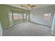 Large bedroom featuring carpet, ceiling fan and multiple windows at 4290 S Gressa St, Pahrump, NV 89061