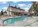 Expansive backyard featuring a pool, patio area, and lush greenery at 4330 Flandes St, Las Vegas, NV 89121