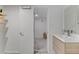 Bright bathroom with stylish vanity and modern finishes; doorway leads to shower at 4330 Flandes St, Las Vegas, NV 89121