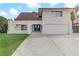 Two-story house with a double door entry and attached garage at 4330 Flandes St, Las Vegas, NV 89121