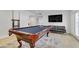 Large game room boasts a pool table, flat screen TV, and comfortable seating at 4330 Flandes St, Las Vegas, NV 89121