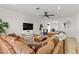 Spacious living room with leather sectional sofa and modern decor at 4330 Flandes St, Las Vegas, NV 89121