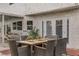 Inviting outdoor dining area with stylish wicker furniture and charming string lights at 4330 Flandes St, Las Vegas, NV 89121