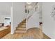 Bright entryway featuring a gracefully curved staircase with wooden treads and white risers, leading to the upper level at 4330 Flandes St, Las Vegas, NV 89121