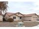 One-story house with terracotta tile roof and neutral color scheme at 4618 Zia Ridge St, North Las Vegas, NV 89031