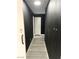 Dark hallway with light grey wood flooring at 4618 Zia Ridge St, North Las Vegas, NV 89031