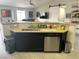 Kitchen area featuring stainless steel appliances, dark cabinetry, a breakfast bar, and a dishwasher at 4618 Zia Ridge St, North Las Vegas, NV 89031