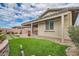 Backyard view of home with artificial turf and pergola at 473 Harvest Rain Ave, Henderson, NV 89011