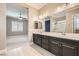 Double vanity bathroom with a view of bedroom and walk-in closet at 473 Harvest Rain Ave, Henderson, NV 89011