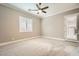 Well-lit bedroom featuring plantation shutters and ceiling fan at 473 Harvest Rain Ave, Henderson, NV 89011