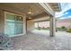 Covered patio with brick pavers and access to a grassy backyard at 473 Harvest Rain Ave, Henderson, NV 89011