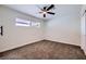 Spacious bedroom with brown carpet and a ceiling fan at 5129 Del Monte Ave, Las Vegas, NV 89146